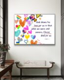 Christian wall art featuring Romans 5:8 with colorful heart icons, symbolizing God’s unconditional love through Christ’s sacrifice.