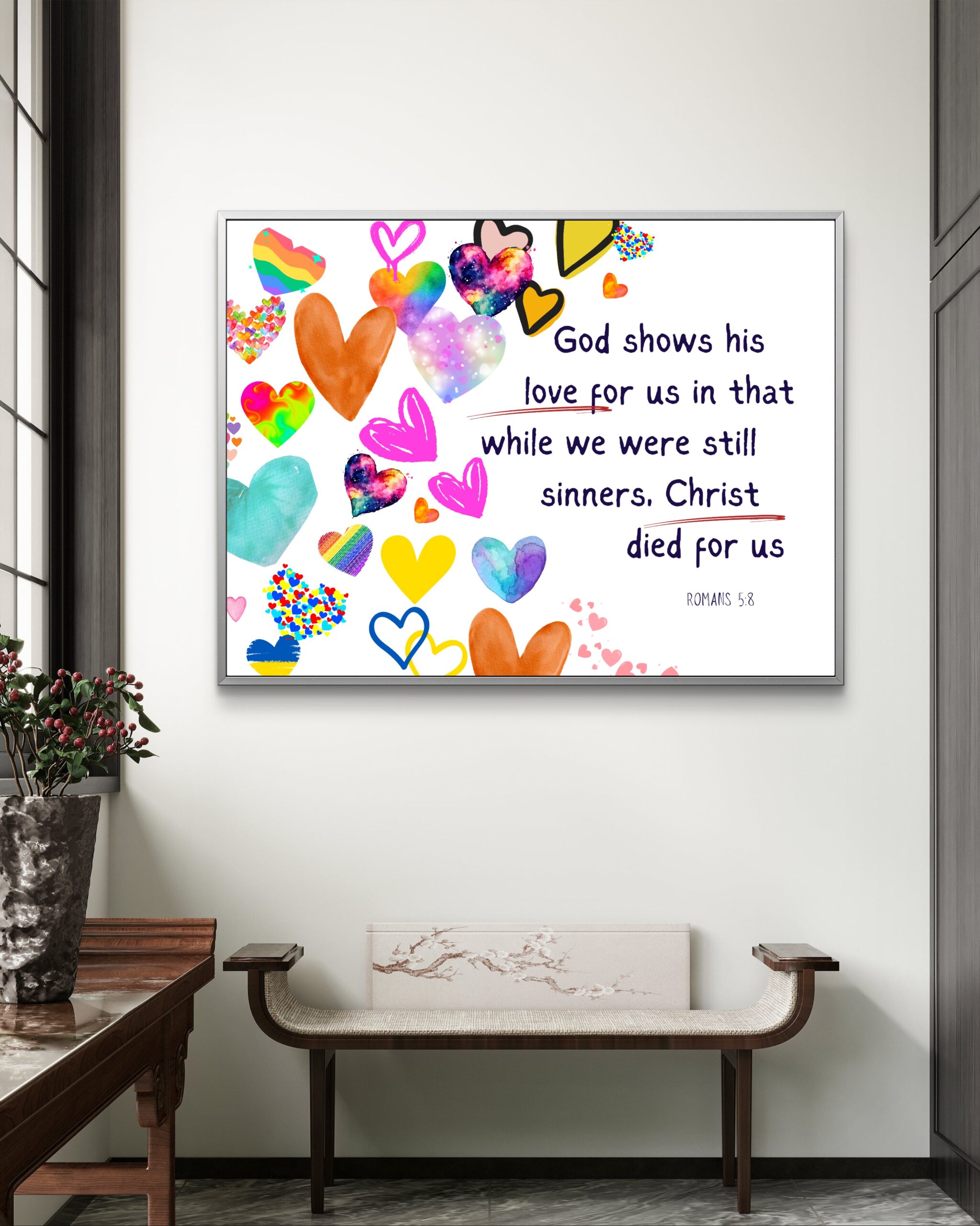 Christian wall art featuring Romans 5:8 with colorful heart icons, symbolizing God’s unconditional love through Christ’s sacrifice.